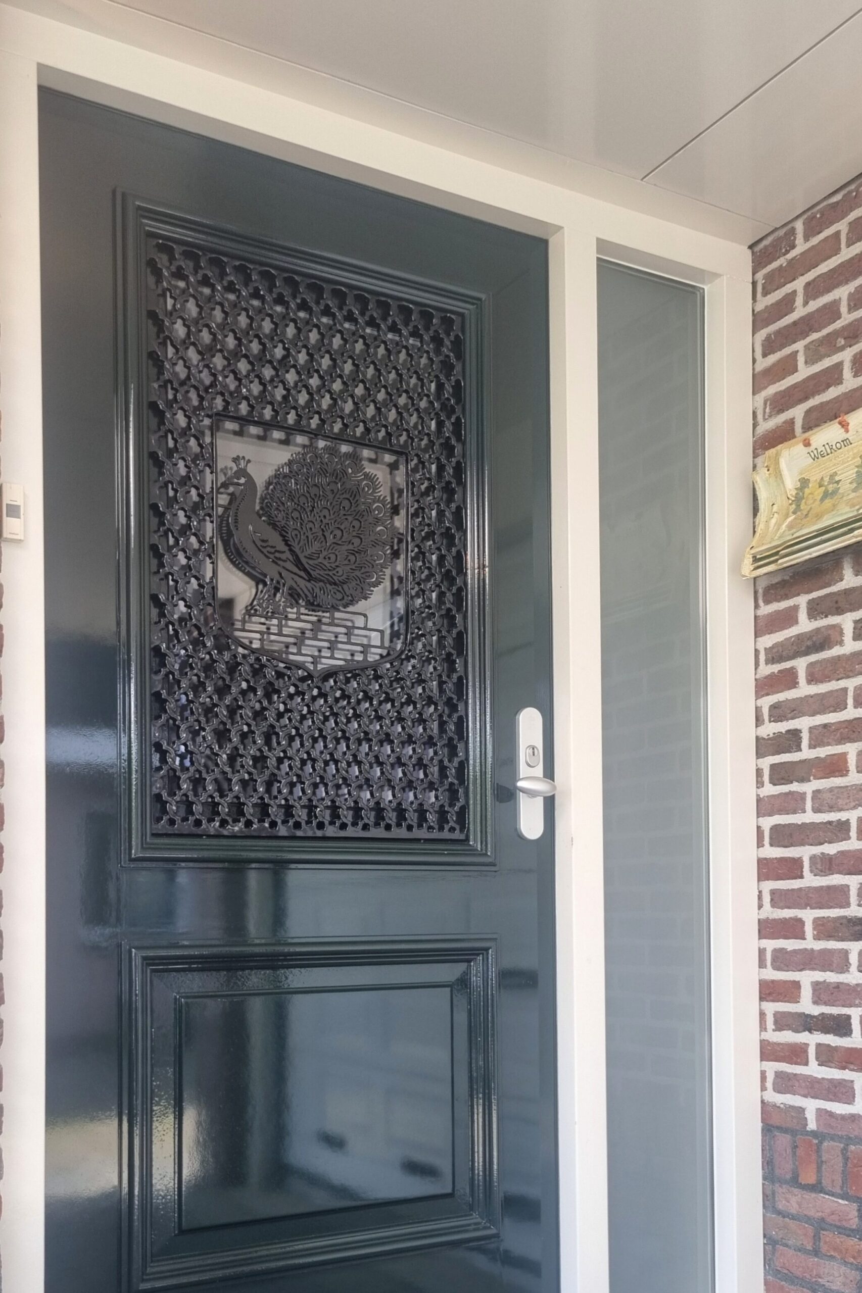 Aangepast gietijzeren deurrooster met familiewapen